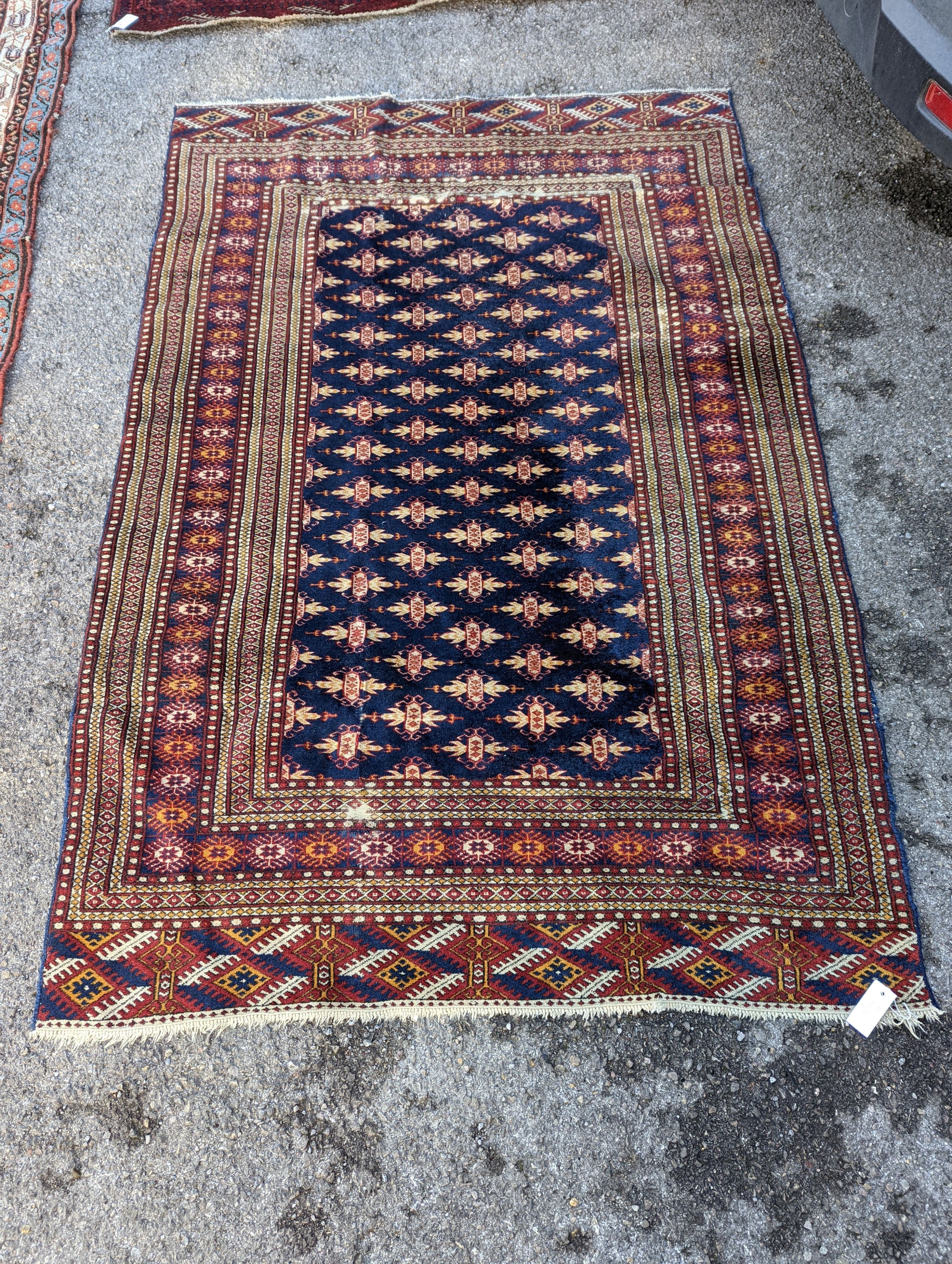 A Bokhara blue ground rug, 191 x 126cm